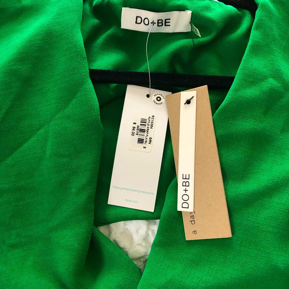Never worn adorable emerald green open back,short jumper.  New with tags